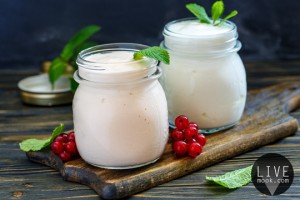 Jars with melted sour milk and natural yoghurt.